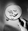 Coins under magnifying glass Poster Print - Item # VARSAL255422489