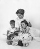 Mid adult woman reading a story book to her children Poster Print - Item # VARSAL25519909A