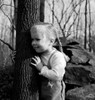 Cute girl  with braids embracing tree Poster Print - Item # VARSAL255416457