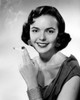 Studio portrait of smiling young woman with cigarette Poster Print - Item # VARSAL2556688