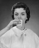 Portrait of a young woman drinking milk Poster Print - Item # VARSAL25512667B