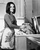 Portrait of a young woman taking clothes out of a washing machine Poster Print - Item # VARSAL2555139
