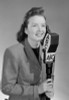 Studio portrait of female reporter speaking into microphone Poster Print - Item # VARSAL255422893