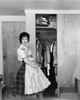 Side profile of a young woman holding a dress Poster Print - Item # VARSAL25541895
