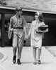 Schoolboy and a schoolgirl holding hands while walking Poster Print - Item # VARSAL25517724