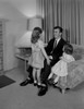 Father relaxing with daughters in living room Poster Print - Item # VARSAL255424911