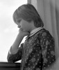 Pensive boy looking through window Poster Print - Item # VARSAL25514406