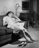 Young woman resting on a couch Poster Print - Item # VARSAL2552883