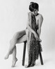 Portrait of a young woman sitting on a stool Poster Print - Item # VARSAL25542173