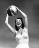 1940s Smiling Woman In White Bathing Suit Holding A Beach Ball Over Her Head Outdoor Print By Vintage Collection - Item # PPI177333LARGE
