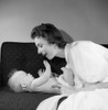 Mother with baby boy on sofa Poster Print - Item # VARSAL255417640A