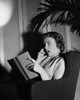 Side profile of a young woman reading a book Poster Print - Item # VARSAL2552921