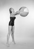Young woman wearing swimsuit holding beach ball Poster Print - Item # VARSAL255421313