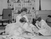 Mother and daughters playing game on living room floor Poster Print - Item # VARSAL255419449