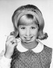 Portrait of a young woman holding a spoon and smiling Poster Print - Item # VARSAL25517041C