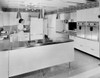 Young woman working in the kitchen Poster Print - Item # VARSAL25514633