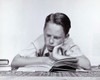 Boy reading a book Poster Print - Item # VARSAL2553202B