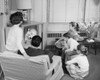 Rear view of parents with their three children watching television Poster Print - Item # VARSAL2551608