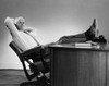 Businessman leaning in a chair with his feet resting on the desk Poster Print - Item # VARSAL2554135