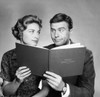 Close-up of a mid adult couple holding a family budget book Poster Print - Item # VARSAL25512567B