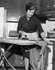 Mid adult woman ironing clothes Poster Print - Item # VARSAL25549233