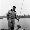 Portrait of man fishing in lake Poster Print - Item # VARSAL255417529