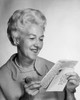 Senior woman reading a letter and smiling Poster Print - Item # VARSAL25548990