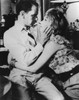Young couple embracing Poster Print