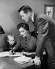 Father and son watching mother writing in a notebook Poster Print - Item # VARSAL25518520