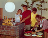 Two teenage couples preparing food on a barbecue grill Poster Print - Item # VARSAL3811361680