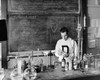 Boy performing an experiment in a chemistry laboratory Poster Print - Item # VARSAL25518141