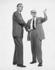 Two businessmen standing together Poster Print