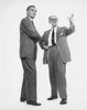 Two businessmen standing together Poster Print