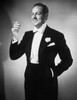 Young man in evening suit standing and holding cigarette Poster Print - Item # VARSAL25523381
