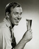 Portrait of a young man holding a glass of beer Poster Print - Item # VARSAL2553021
