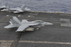 South China Sea, November 23, 2013 - An F/A-18F Super Hornet lands on the flight deck aboard the aircraft carrier USS Nimitz. Poster Print - Item # VARPSTSTK108131M