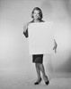 Portrait of a young woman holding a blank placard Poster Print - Item # VARSAL25541943