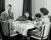 Mature couple with their children praying at a dining table on Thanksgiving Day Poster Print - Item # VARSAL25539908