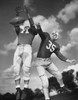 Low angle view of two football players playing football Poster Print - Item # VARSAL25514400A