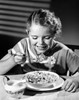 Girl eating corn flakes and smiling Poster Print - Item # VARSAL2553304A
