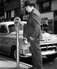 Mid adult man using a parking meter Poster Print - Item # VARSAL25526570
