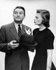 Young woman pointing at man Poster Print - Item # VARSAL25512453