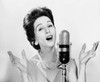 Young woman singing into a microphone Poster Print - Item # VARSAL2553365B