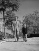Father and son walking through park Poster Print - Item # VARSAL255417520