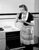 Happy young woman trying freshly baked pie Poster Print - Item # VARSAL255423294