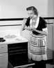 Happy young woman trying freshly baked pie Poster Print - Item # VARSAL255423294