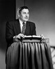 Mid adult man standing at a lectern and talking Poster Print - Item # VARSAL25543265