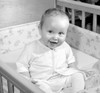 Portrait of cheerful baby sitting in cot Poster Print - Item # VARSAL2559655