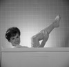 Portrait of young woman washing leg in bath Poster Print - Item # VARSAL255418388B