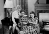 Mother reading book with son and daughter in living room Poster Print - Item # VARSAL255420203